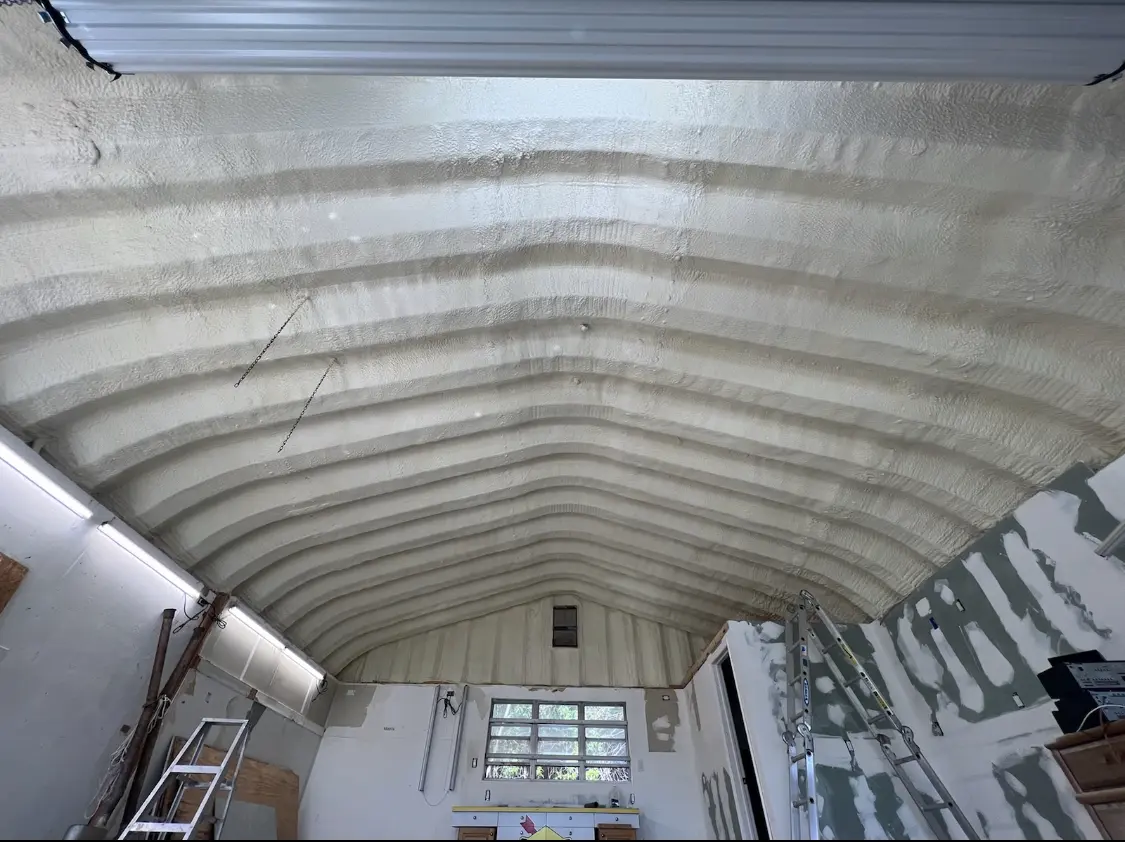 Spray polyurethane foam applied to the underside of a metal roof deck in Kannapolis
